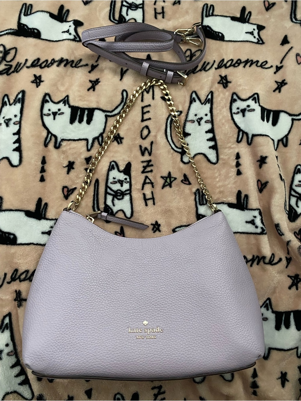 Kate Spade light purple shoulder and crossbody with gold hardware.